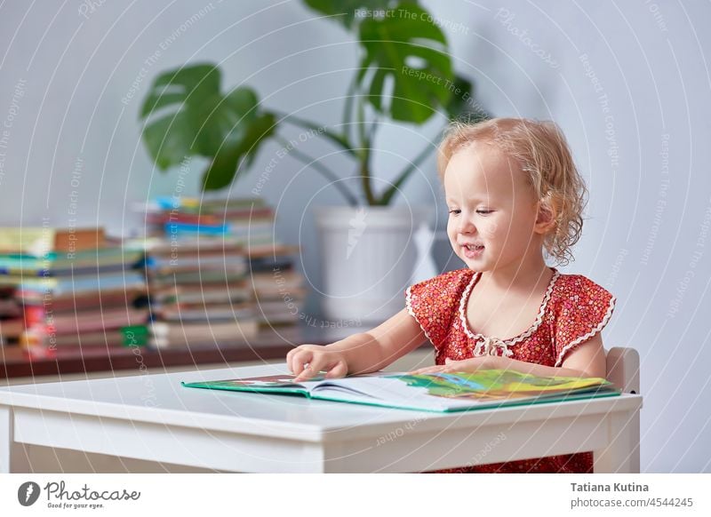 smart baby girl reading