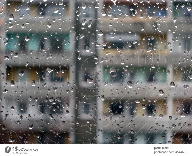 Raindrops on the windshield and across the street you see a prefab building Pane raindrops Transparent Inspiration Dreary Gloomy Window pane Drops of water