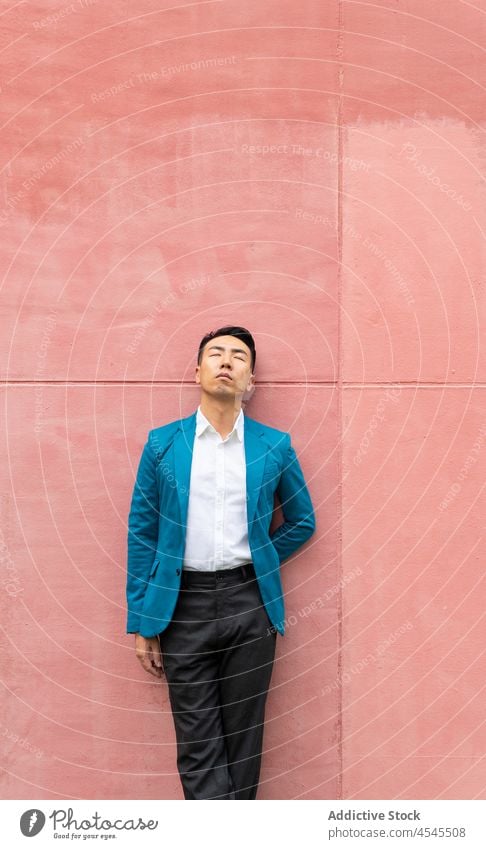 Hipster in classy wear standing on the street - a Royalty Free Stock Photo  from Photocase