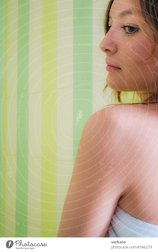 Attractive And Smiling Woman In Towels Looking At Camera In Sauna