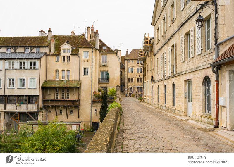 Beuatiful view of cobbled ancient street in Dole, France dole france village town travel destination alley stone medieval old golden city vacation background