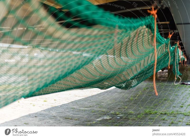 Suspended net under a bridge - a Royalty Free Stock Photo from Photocase