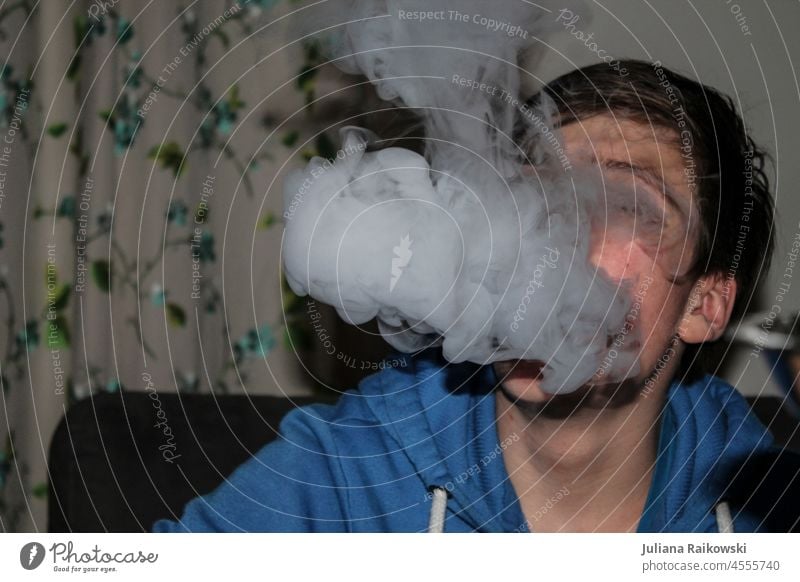 Teenager smokes shisha disgusting Smoky Healthy Cigarette smoke tilt Disgust Smoking Nicotine Unhealthy Health hazard Harmful to health Dependence