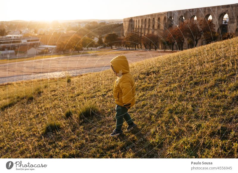 Child with Yellow hooded jacket childhood 1 - 3 years one person Caucasian Authentic Autumn Winter Hooded (clothing) Hooded jacket Jacket Infancy Day