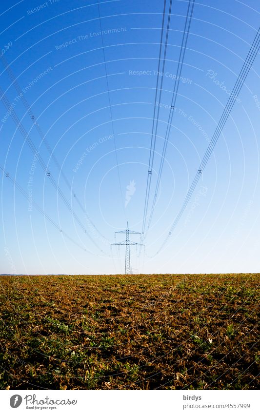 High voltage power line with power pole in a field. Power line Electricity pylon Energy industry Power transmission power supply transmission line stream Meadow