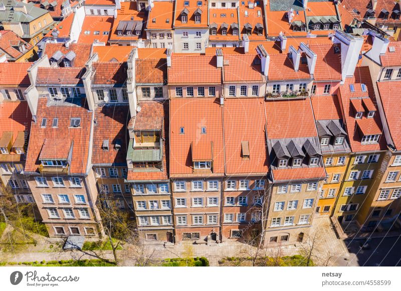 Warsaw, Poland red orange roof in old town market square with historic street town architecture and windows rooftop closeup pattern Ancient Apartment