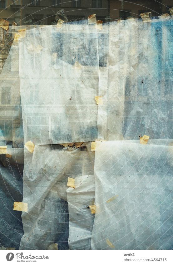 paperwork Pane Glass Paper remnants Sellotape bequest adhesive tape Exterior shot Window Deserted Adhesive tape Shop window Detail Screening hung worn-out