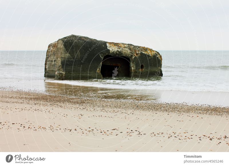 Bunker remnant in the North Sea Dugout Concrete Water Waves Beach Sand Horizon Sky stones Denmark Deserted Colour photo bunker residue Old Block disruptive