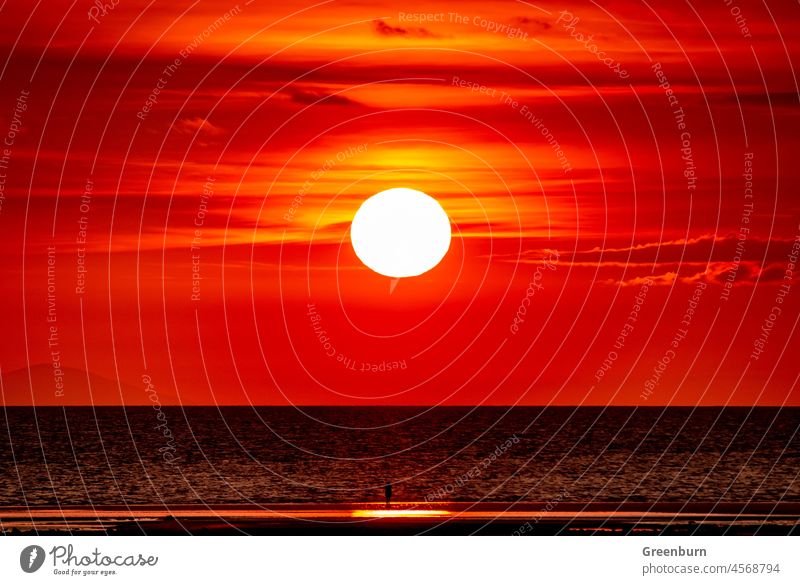 UK Weather, sunset view towards the distant Isle Of Man from Walney Island on the Cumbrian Coast. sea Ocean Sunset Beach Water Sky Evening Waves Nature Horizon