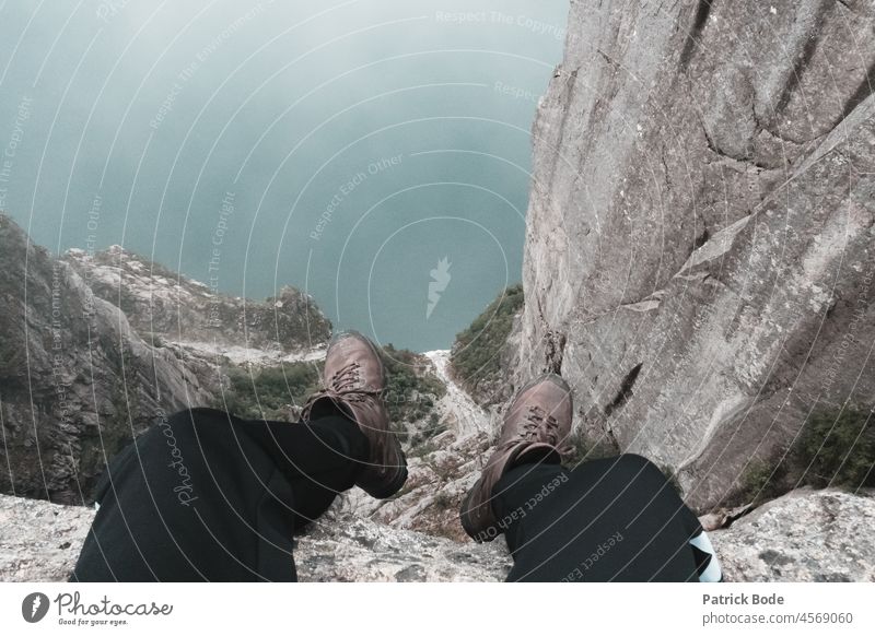 View into the abyss Copy Space top Detail Exterior shot Calm Serene Sit Cliff Footwear Rock Life Adventure Human being Feet Freedom Vacation & Travel