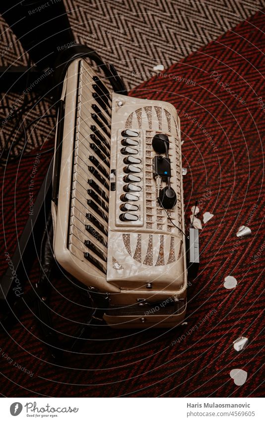 old accordion on the dance floor acordian acordion antique art arts background black black background classical closeup culture equipment folk harmonica