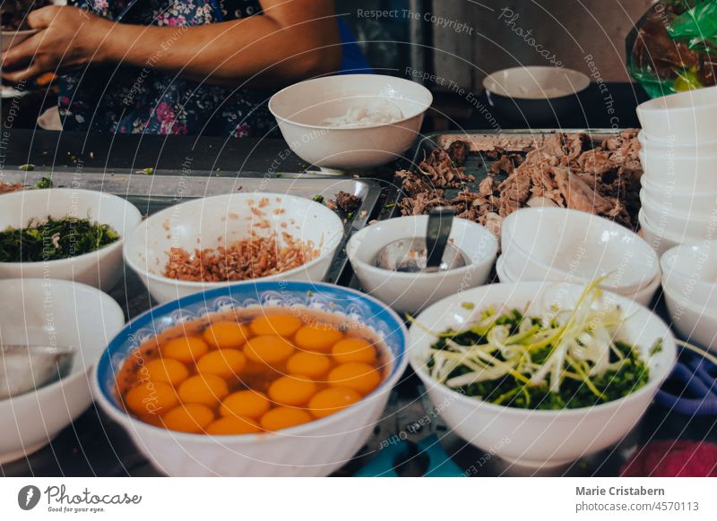 Vietnamese soup stand along the streets of Hanoi City that showcases Vietnam's food culture business tradition small business asia indochina occupation