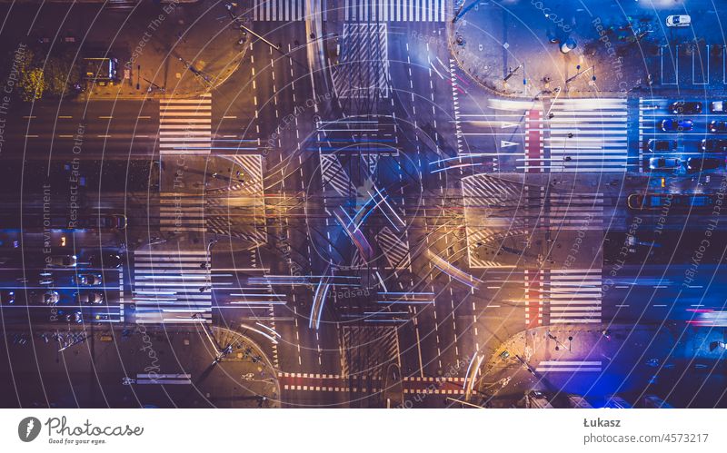 Night aerial view of an intersection, car ride seen from above, city perspective Crossroads Antenna right above from top to bottom Abstract Transport cars