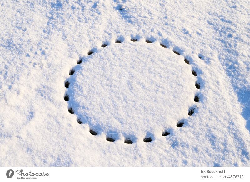 manhole cover pattern in snow Winter light Wintertime white background chill winter Deserted Ice snow-covered footprints circularly Circular Round Circle trace