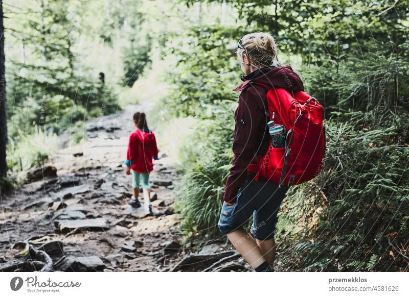 Girls on Summer Vacation Hiking Trip in the Mountains. Stock Photo