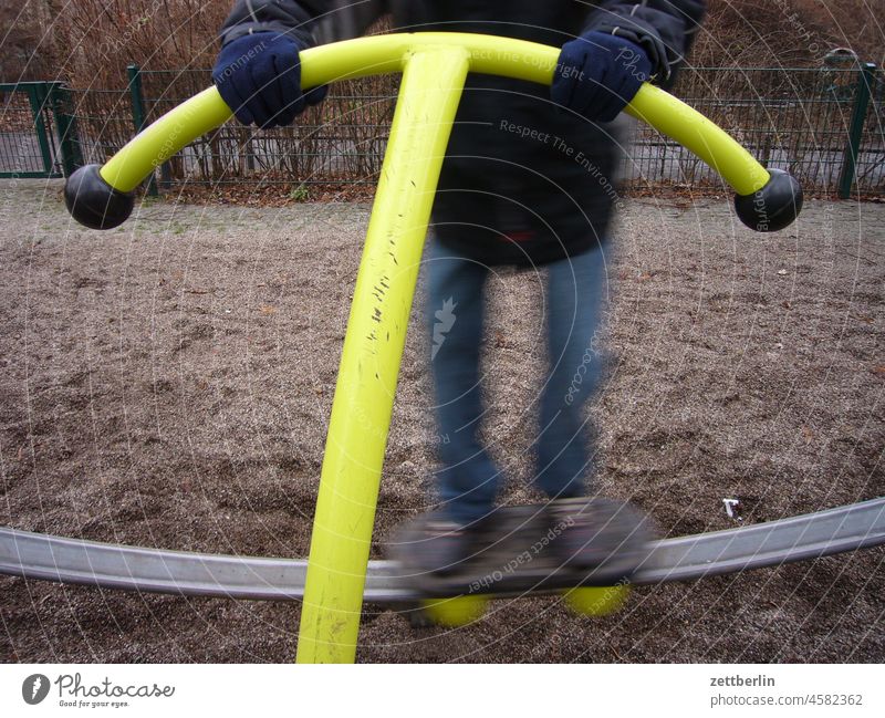 on the playground Child game Playing Playground Movement motion blur Sports Equipment Sports equipment game device skater stop Swing Autumn Winter out fresh air