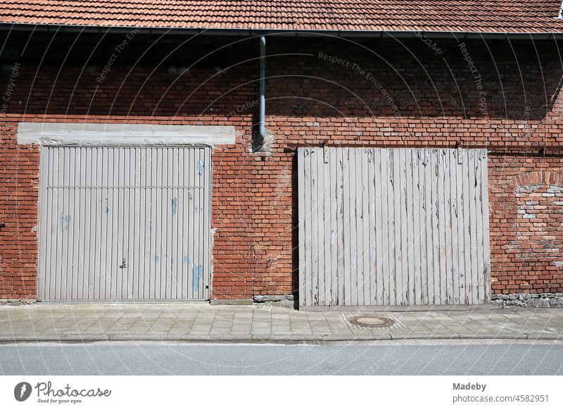 Passage forbidden with round traffic sign in front of blue sky in sunshine  at a construction site on a road in Blomberg in East Westphalia-Lippe,  Germany - a Royalty Free Stock Photo