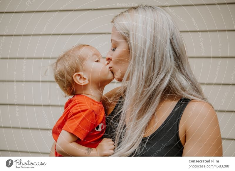 Little golden blonde boy kissing his mom on the lips Blonde Kid Child Children Childhood Kissing Kisses Mom Motherhood parent happy love together woman Travel