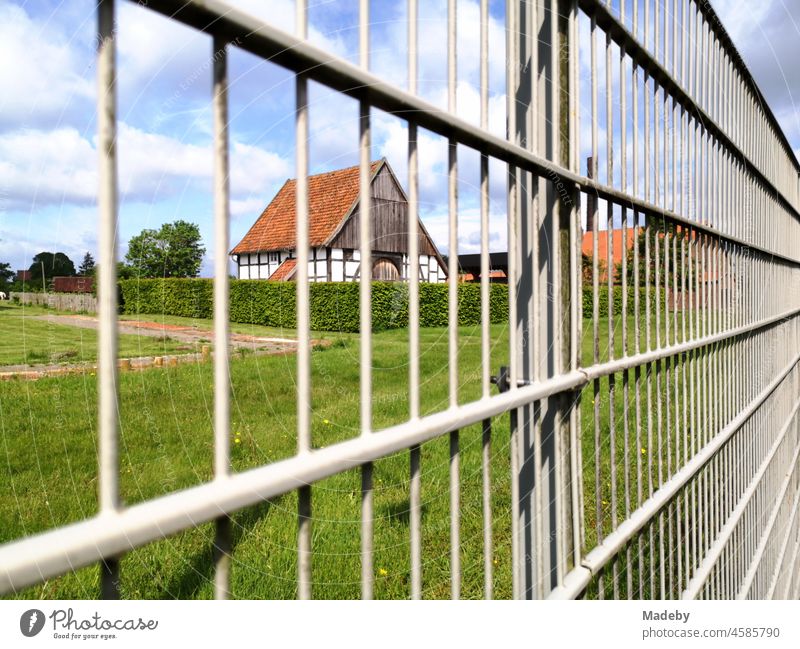 Metal fence around the area of the old brickyard as an industrial museum in summer at sunshine in Lage near Detmold in East Westphalia-Lippe Fence Metalware