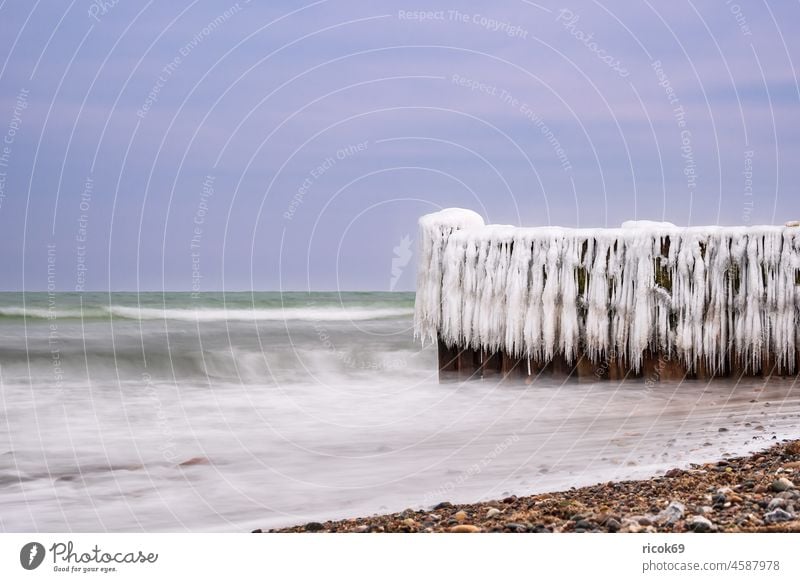 Buhne in winter on the coast of the Baltic Sea near Kühlungsborn. Break water Winter Ice Beach Baltic coast Ocean BUK stones Clouds Nature Landscape vacation