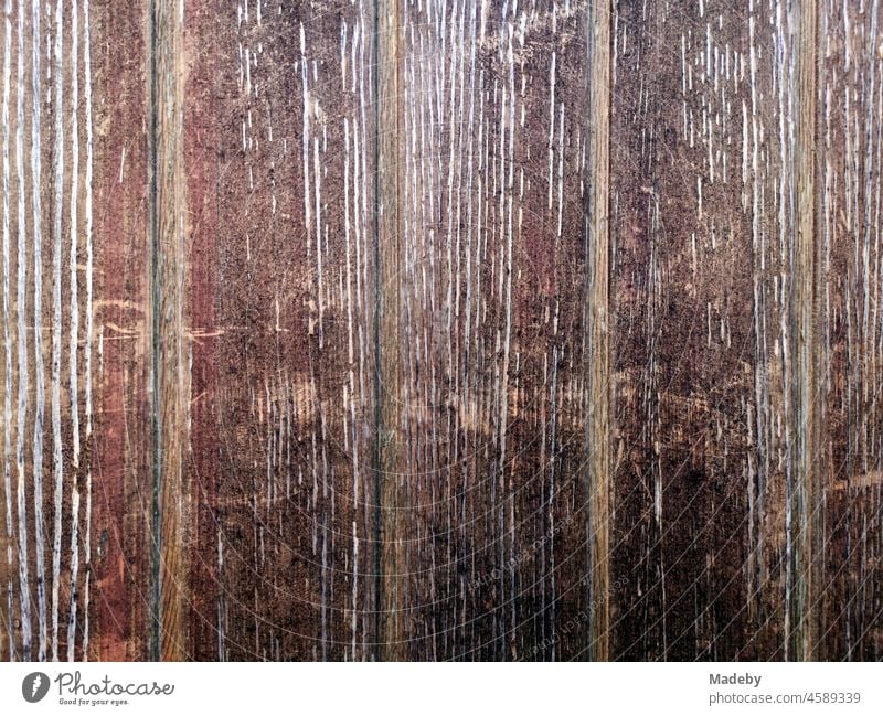 Old brown wood of a wooden door in the main street in the old town of Oerlinghausen near Bielefeld at the Hermannsweg in the Teutoburg Forest in East Westphalia-Lippe