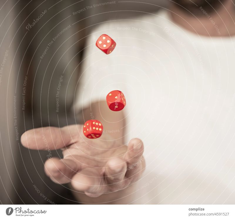 Man juggling with red dice cubes Gambler profit result matter of luck fortune think positive winner rollin dices dauntless calculate finance bid lucky gambling