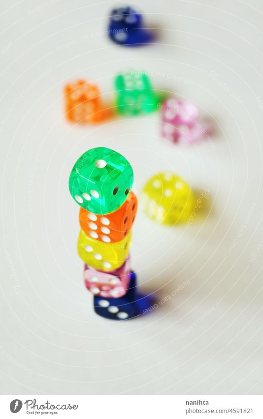 A vibrant colorful macro with depth of field about glass gambling dice, isolated and stacked ones, on white background. luck game bet abstract addiction amazing