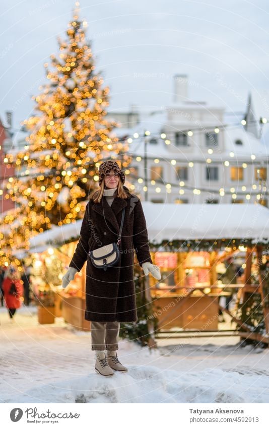Woman at Tallinn Christmas market christmas woman lifestyle happy tallinn estonia holiday winter person outdoors city street smiling adult town europe festive