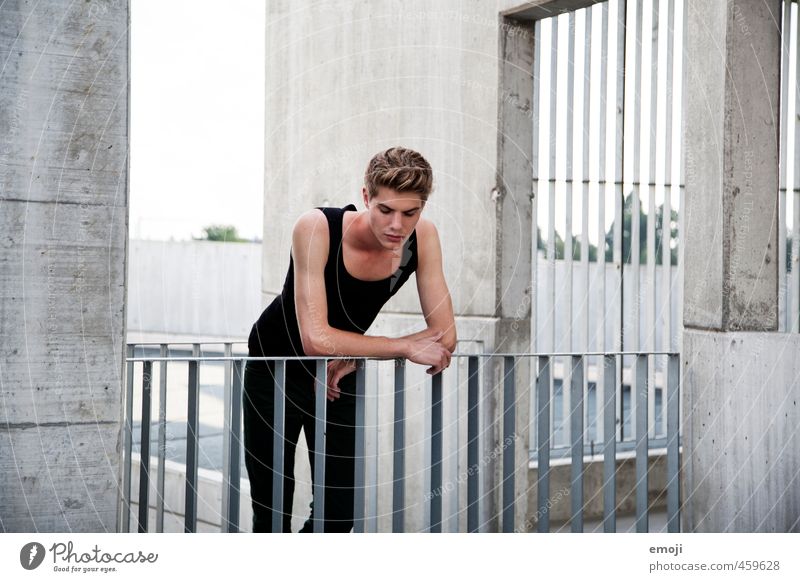 fence Masculine Young man Youth (Young adults) 1 Human being 18 - 30 years Adults Wall (barrier) Wall (building) Town Gray Concrete Concrete wall Colour photo
