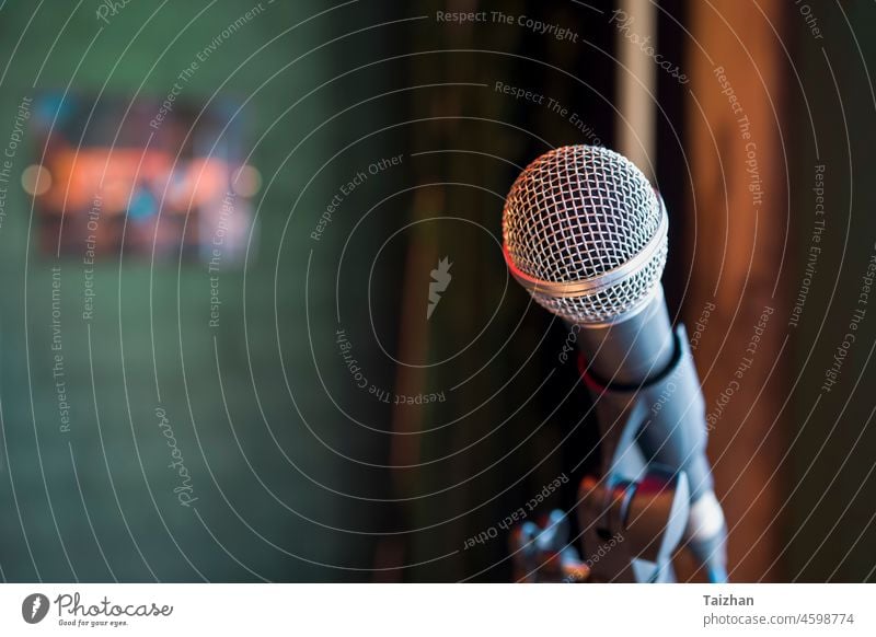 Close up of microphone in concert hall . Copy space . Selective focus room copy space bokeh soft focus lights business audio chrome karaoke object song pop