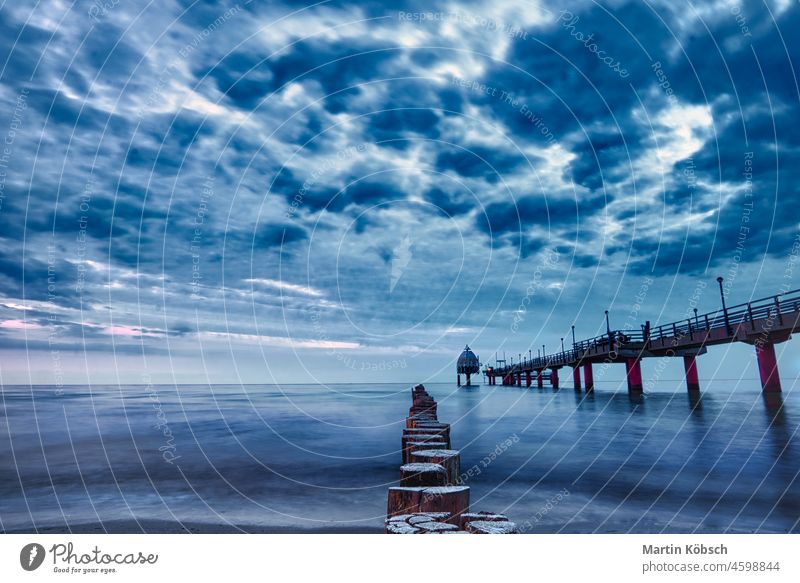 Zingst pier in a long time exposure travel vacation Water Ocean Baltic Sea Perspective sunny Sea view Bright spot Mood lighting Sky Lake Break water Blue