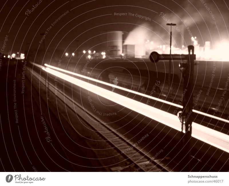 Regional train in front of "sugar beet factory skyline" Long exposure Dark Speed Railroad tracks Industrial Photography Bright Smoke
