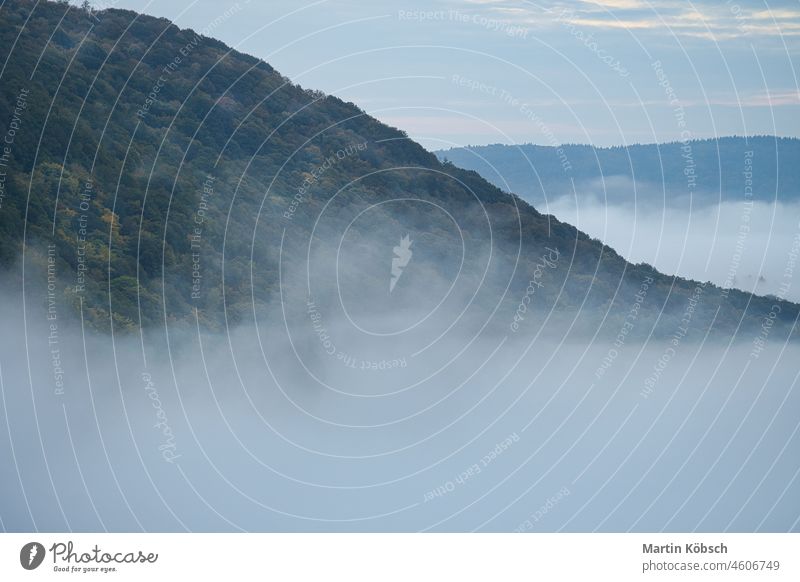 Fog rising on the mountains of the small Saar loop sunrise saarschleife saarland germany landscape cloud freedom sunbeam river fog vacation far massive nature