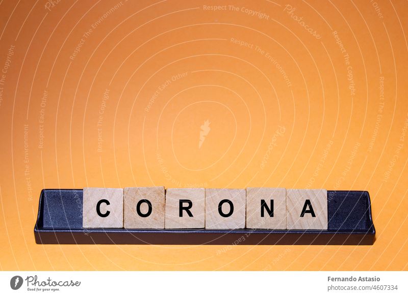 Coronavirus. Covid-19 written with letters. Orange background and space for text. Horizontal photography. coronavirus illness epidemic pandemic medical vaccine