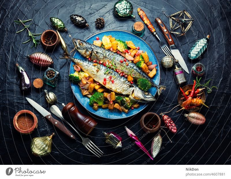 Roasted mackerel fish, seafood roasted pineapple baked christmas Christmas decorations scomber grilled fish whole plate dish copy space space for text fresh