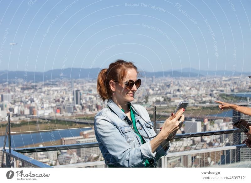 Woman in Osaka on the Umeda Sky Building Japan Colour photo Exterior shot