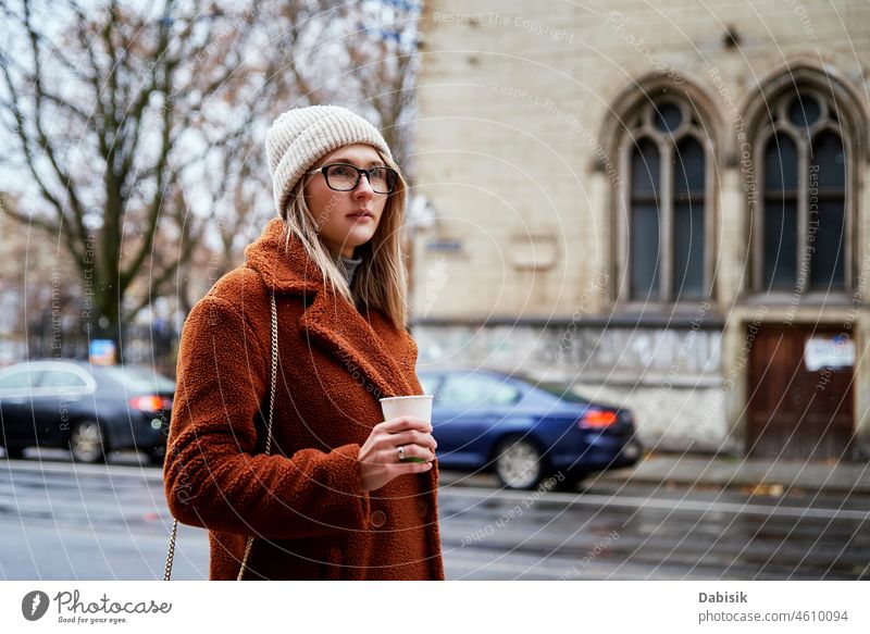 Stylish woman walking in city - a Royalty Free Stock Photo from Photocase