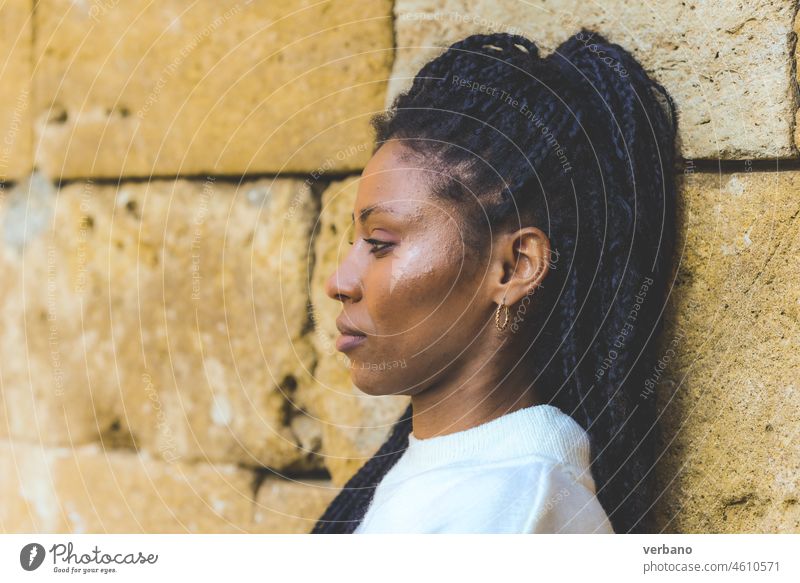 profile of a young african confindent young woman dreadlocks black beautiful female cheerful happy adult happiness portrait girl people lifestyle attractive