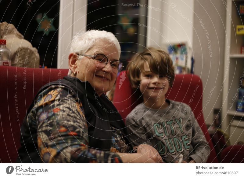 Grandma with her grandson White-haired Domestic happiness young and elderly togetherness 60 years and older Contentment Grandchildren Colour photo Adults