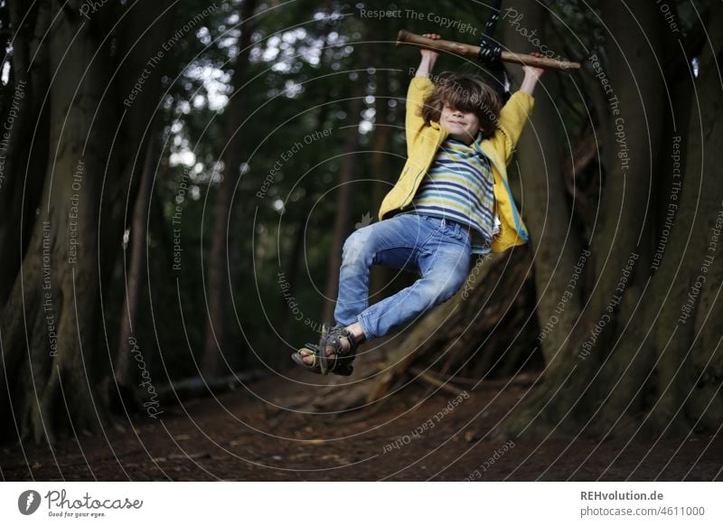 Child swinging on a swing in the forest 3 - 8 years Childhood memory Emotions Happiness To swing Children's game Movement Infancy Swing Joy Happy fun naturally