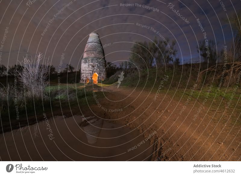 Old kiln near pond at night countryside sky cloudy reflection calm old craftsmanship water lake shore scenic tranquil season breathtaking aged dusk peaceful