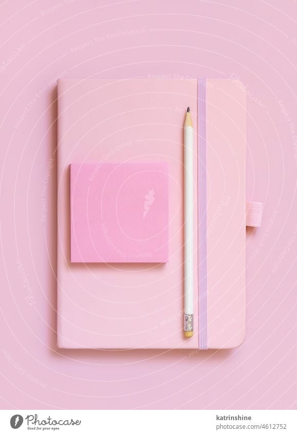 Pink notebook, pencil and paper on light pink top view pile textbook school mockup stack top view. education study heap concept learning blank sketchbook