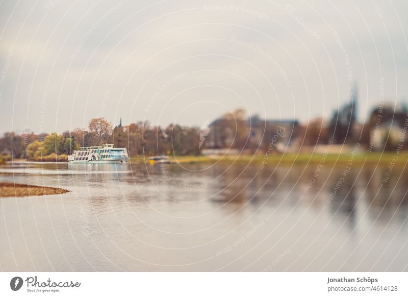 Ship on the Elbe in Dresden view from the Elbe bank in the dull autumn Horizon outlook Elbufer Dreary Gloomy Autumn Saxony blurriness tilt effect Bleak November