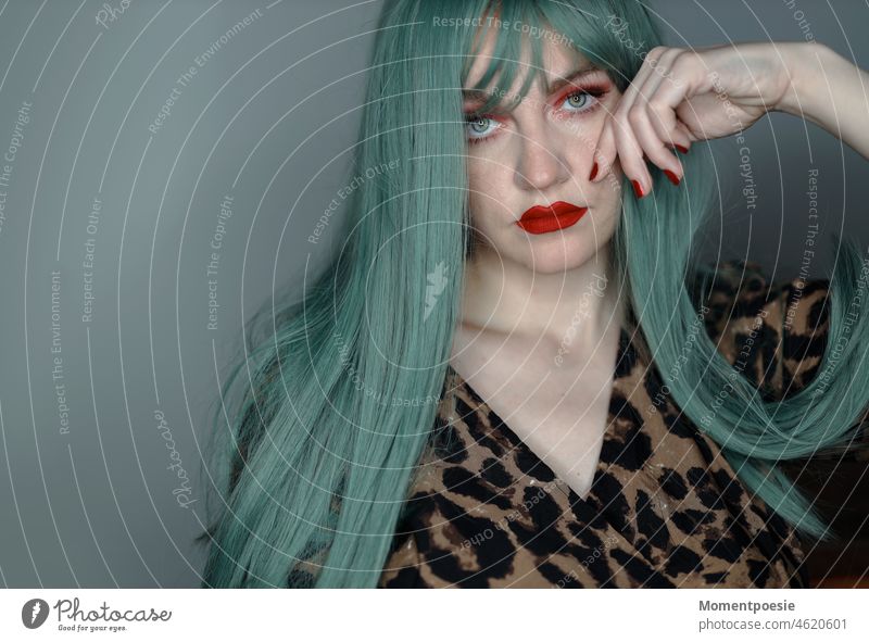 green haired woman Green Wig frown Bangs red lips pretty Exasperated communication Wait Esthetic Style Lifestyle portrait Woman Adults Leopard pattern Panther