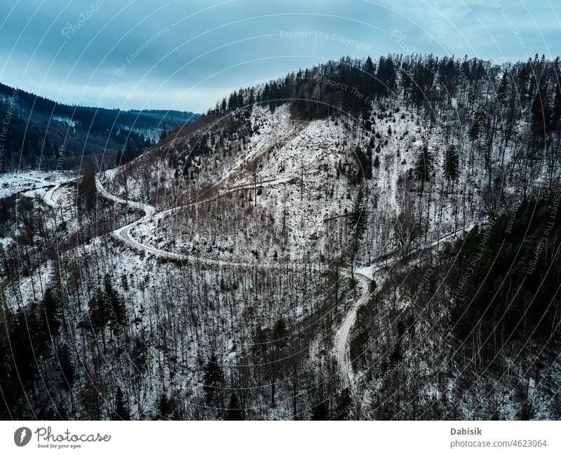 Landscape with winding road through mountain, aerial view winter landscape forest nature serpentine outdoor car green highway trip countryside travel tree