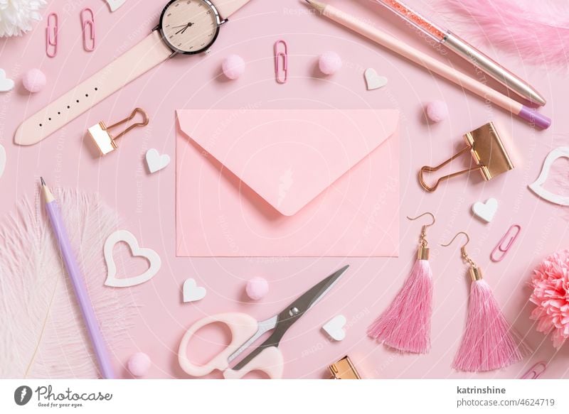Pink envelope, school girly accessories and hearts on pastel pink top view, mockup education valentine stationery love romantic message feminine pompoms
