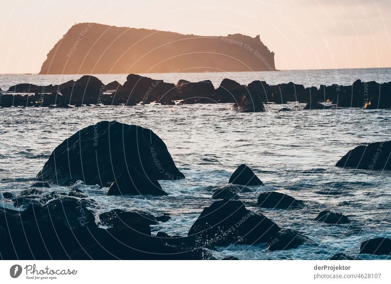 Waves and rocks in the Azores in the evening II Central perspective Deep depth of field Sunlight Reflection Contrast Shadow Copy Space middle Copy Space bottom