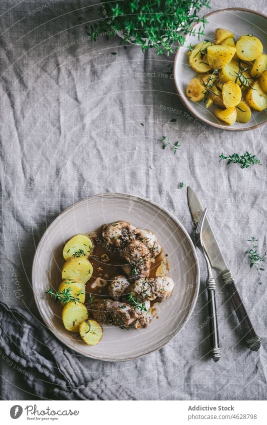 Tasty rabbit stew with potatoes in plate on table meat serve dinner tasty fresh meal food dish cuisine delicious bowl tradition appetizing nutrition gourmet