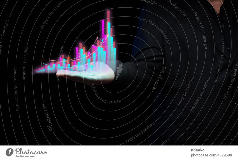 holographic chart growth indicators and a businessman in a black suit. Increasing profitability, high business efficiency. Dynamics of indicators analysis