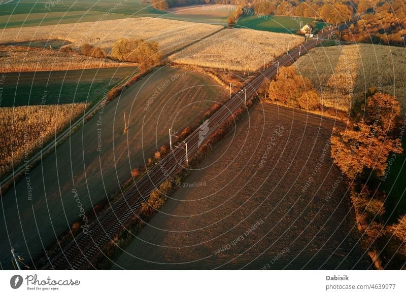 Aerial view of railway countryside landscape at sunset train aerial industrial transport railroad cargo transportation industry rural junction track transit